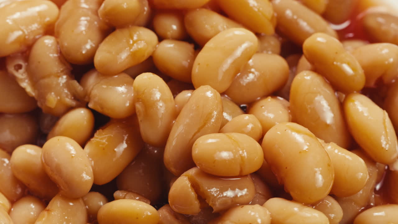 Canned red bans preserved beans rotating background close up side view. Organic steamed beans. Pickled bean for a Mexican dish