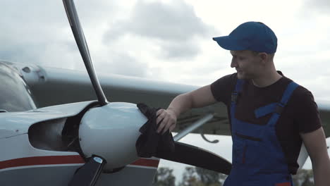 airplane mechanic working on propeller