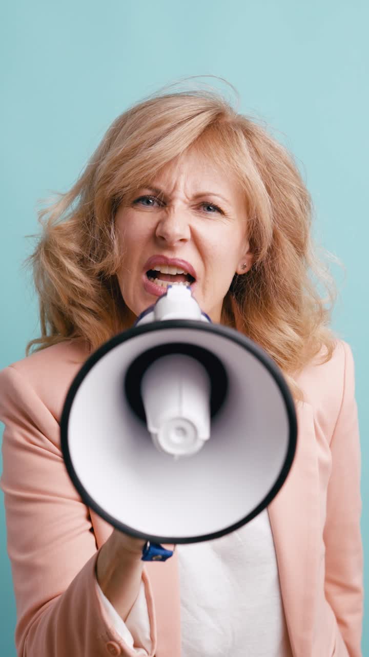 Angry Woman Shouting into Megaphone on Blue Background