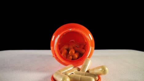 moving-past-cap,-quickly-pushing-into-the-entire-length-of-a-orange-supplement-pill-bottle