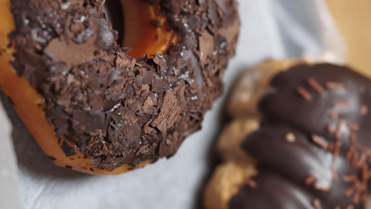 Close-up of a chocolate donut with chocolate shavings