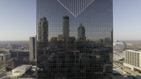 skyscrapers reflect from the windows of another skyscraper