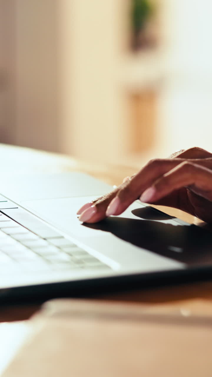 Close-up of Hands Typing on Laptop Keyboard