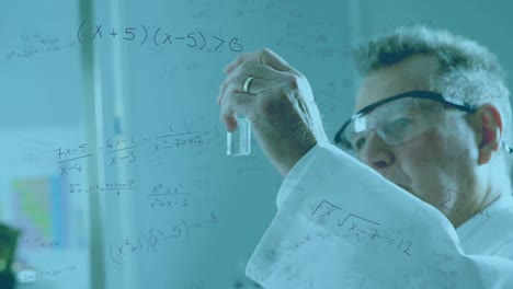 mathematical equations moving against male scientist working in laboratory