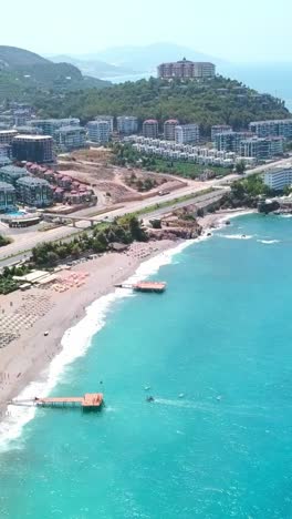 aerial view of a beautiful beach resort with city in the background