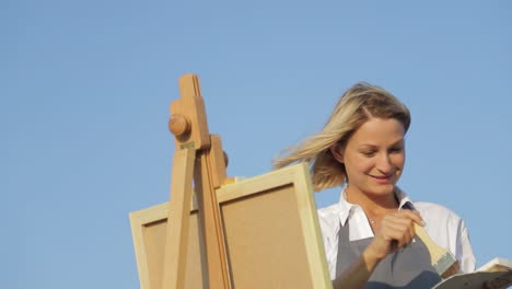 woman painter working outdoors