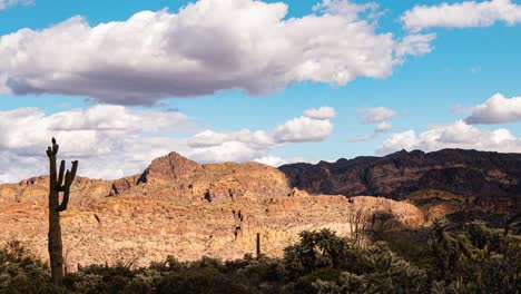 time lapse of clouds flying over a hawk in a desert canyon in the southwest