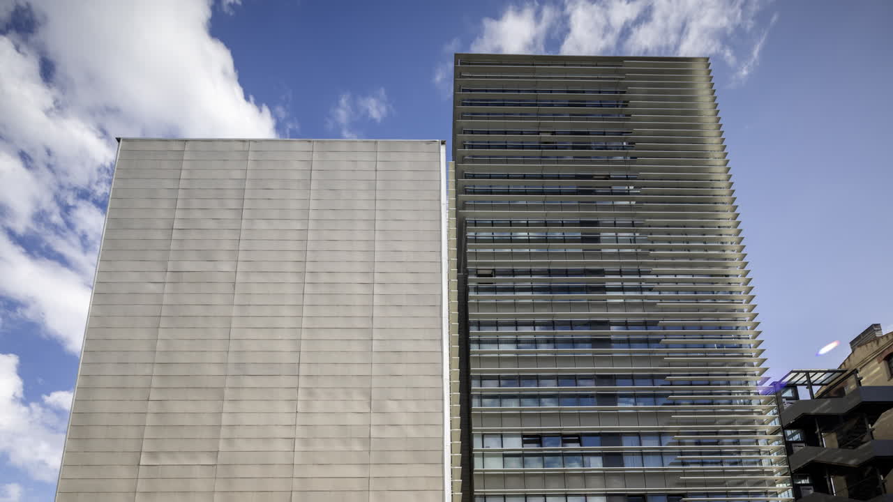 Office Tower in barcelona with passing clouds timelapse