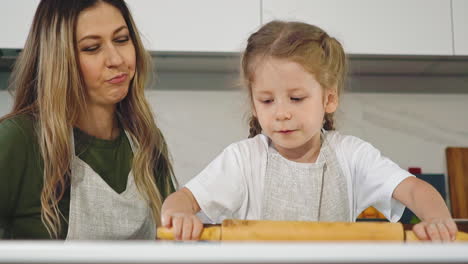 little-girl-diligently-rolls-out-and-prepares-dough