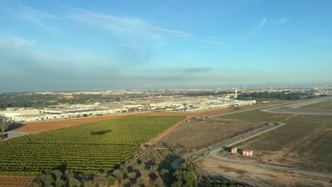 side view from a jet cockpit during the approach to land with the view of the shadow of the plane