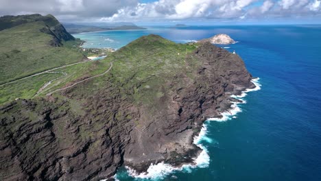 Hawaii&#039;s coastal landscape captivates with its perilous beauty, featuring towering white waves and volcanic rock