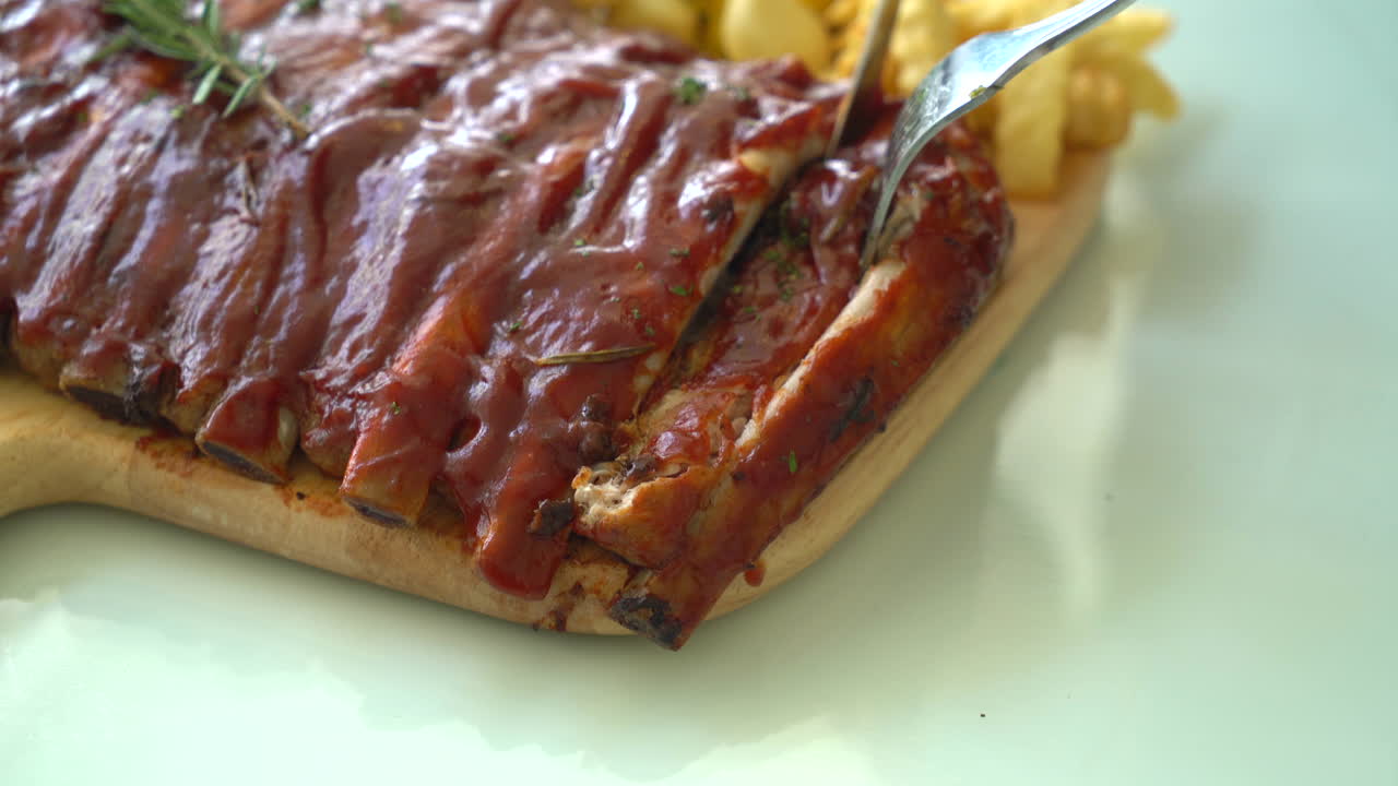 Grilled rib pork with barbecue sauce and vegetable and frech fries