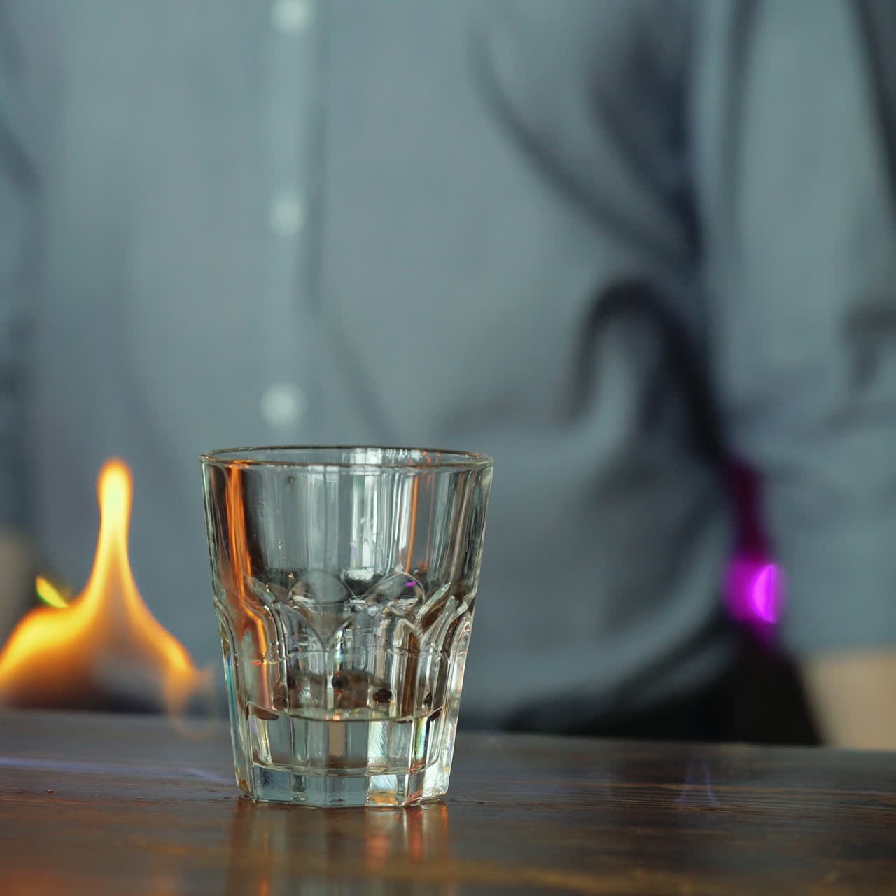 Young bartender making cool cocktail on fire. Sqare video