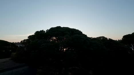 aerial view of orange sunrise behind the mountains