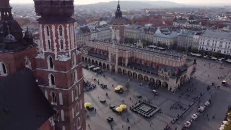 aerial flying towards renaissance cloth hall on main market square, krakow