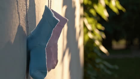 socks drying on a wall