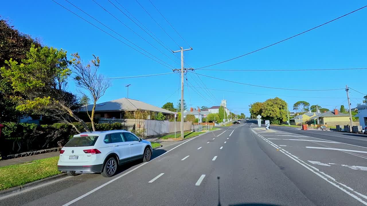 A smooth drive through Bellarine, Victoria, showcasing suburban streets, clear skies, and vibrant greenery under bright daylight