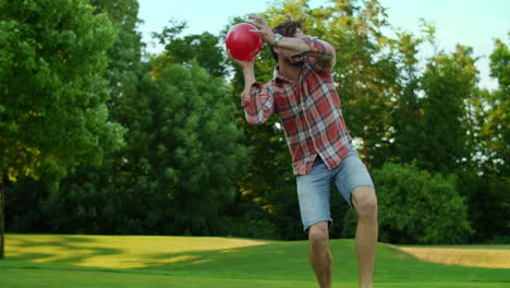 family enjoying summer outdoor activity. parents and kids playing with ball