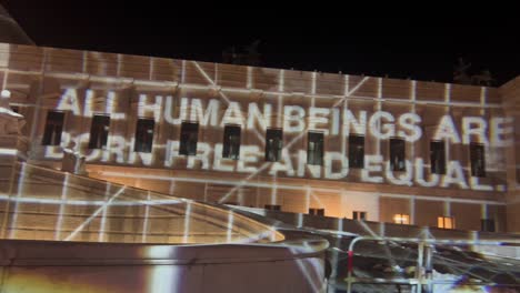 ''all human beings are born free and equal'' sign on parliament building in vienna, austria