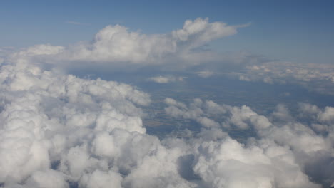 Freedom-of-flying-through-the-clouds-above-fields-on-an-aircraft-plane-airliner