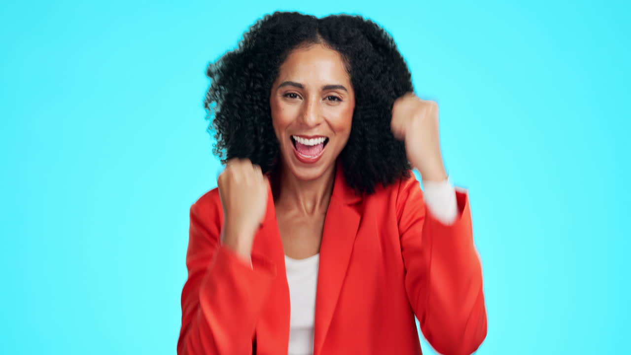Success, winner and face of woman in a studio