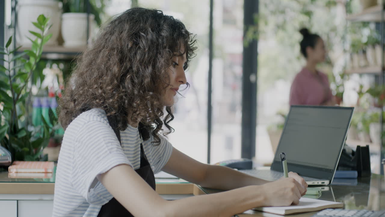 Woman working in a flower shop