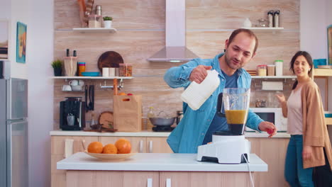 pouring milk in blender