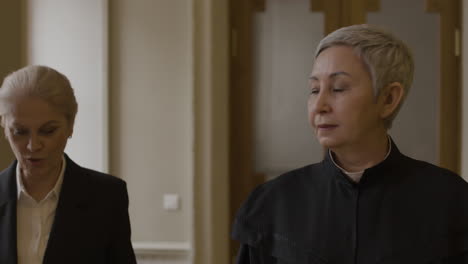 two women lawyers in a courtroom