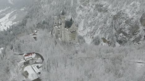 aerial view of neuschwanstein flying away from the castle