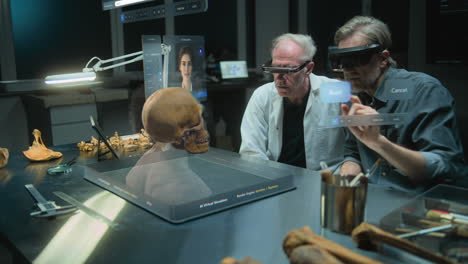 two scientists wearing vr glasses view a 3d model of a human in a virtual reality environment