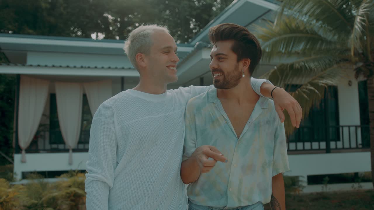 Happy Gay Couple at Tropical Home