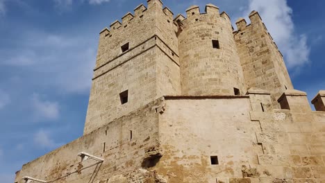 cordoba - the torre de calahorra view of the ancient fortress against a blue sky