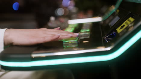 woman playing slot machine.