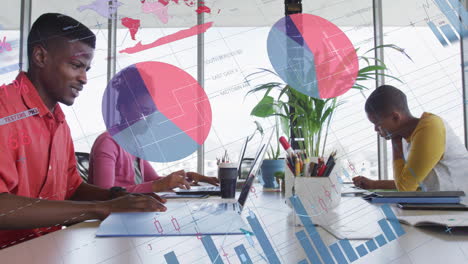 business data and charts animation over diverse team working on laptops in office