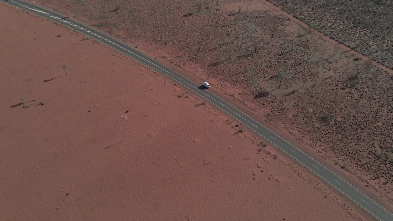 Camper Van Parked On The Roadside. Uluru Road In Northern Territory, Australia. aerial drone