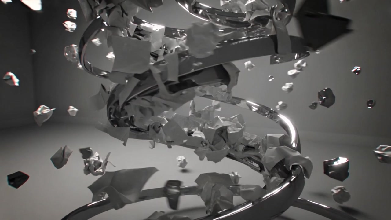 Reacting to impulse reflective metallic helix shedding paper fragments and shards in studio light