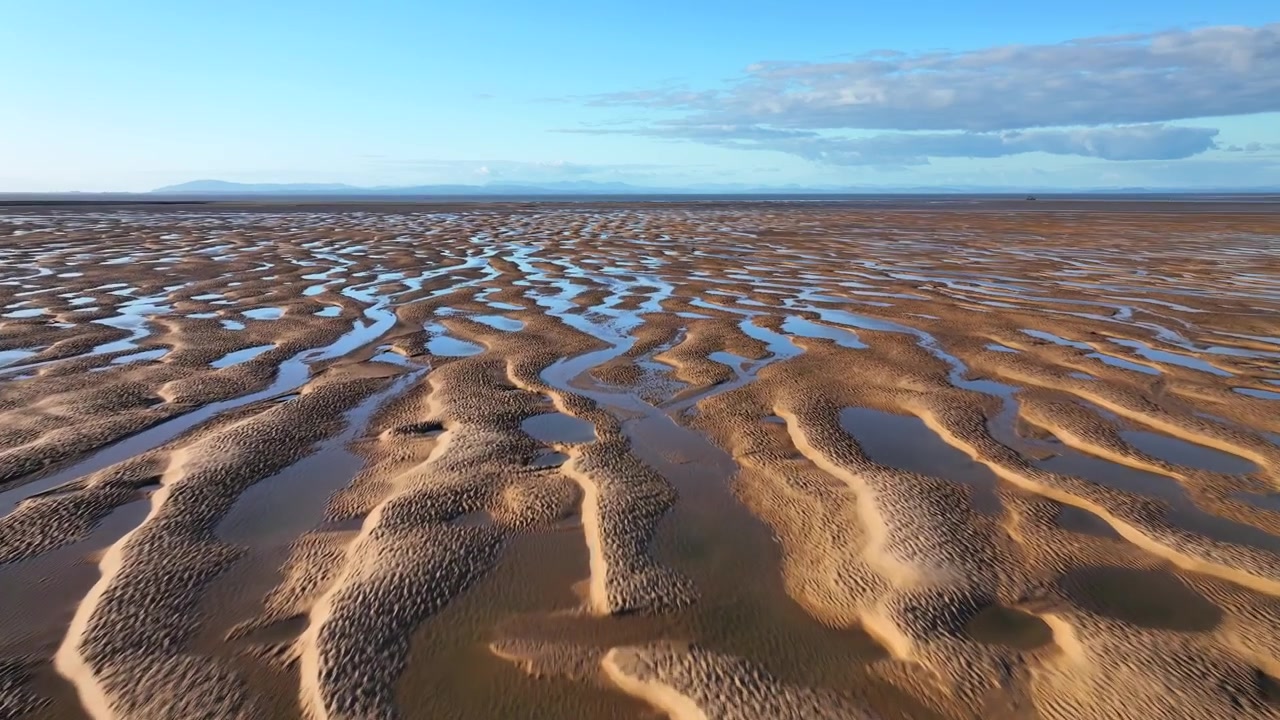 Sky Reflected In Tidal Pools At Golden Hour. Low Flight Over. Fleetwood, Lancashire, England, UK.