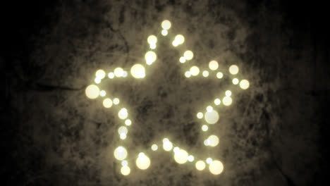 estrella brillante de luces de hadas en un fondo gris