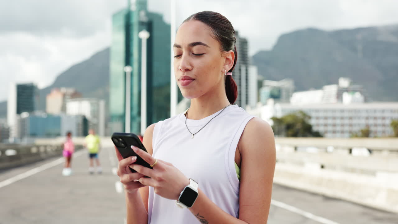 Young Woman Using Smartphone Outdoors in City