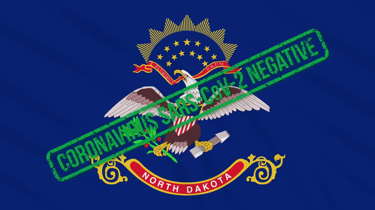 미국 노스다코타 주 (north dakota) 의 발은 코로나 바이러스로부터의 자유의 녹색 스프로 흔들리고 있습니다.