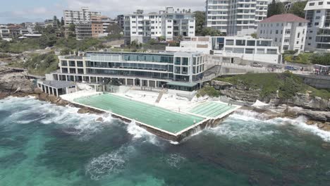 crashing waves at bondi icebergs swimming pool in summer - bondi beach, nsw, australia