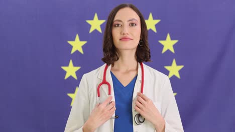 female doctor with stethoscope in front of european union flag