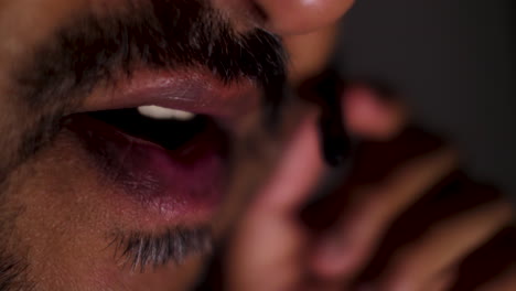 macro shot of a asian man's mouth engaged in conversation, highlighting the portrayal of facial expressions, gestures, and communication