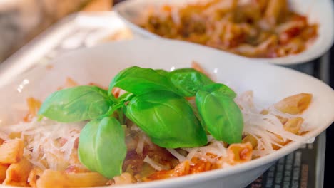 cinemagraph of smoke emitted from a portion of hot penne pasta