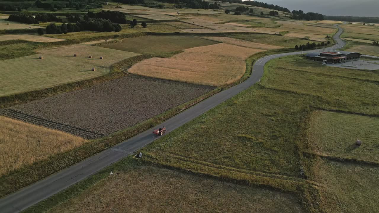 Cars, Agricultural tractor drive at Les Angles France Aerial View road around green rural fields