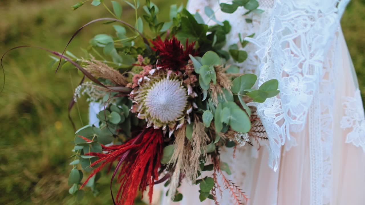 Wedding bouquet in bride hands. Bride bouquet in the hands of the bride