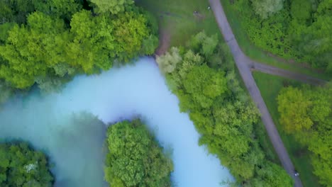 top down aerial view of road by the river