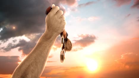 hand of athlete holding gold medals