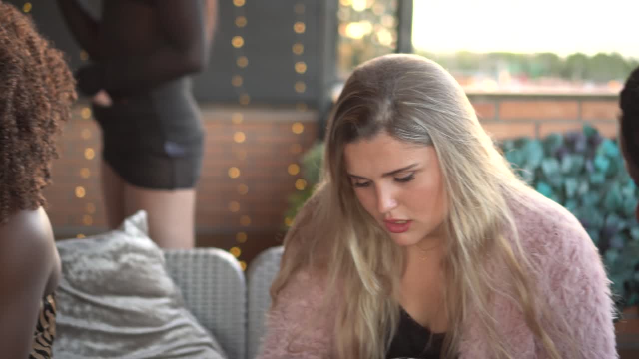 Friends Enjoying a Social Gathering at an Event or Restaurant