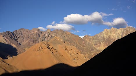 colorful landscape in the andes mountains with blue sky and clouds